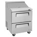 A stainless steel refrigerated sandwich prep table with two drawers.