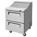 A stainless steel Turbo Air 2 drawer refrigerated sandwich prep table on wheels.