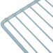 A blue coated wire shelf with a metal handle.