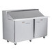 A stainless steel Traulsen refrigerated sandwich prep table with 1 left hinged door and 1 right hinged door.