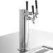 A Beverage-Air black kegerator with a silver tap and black handles on a counter.