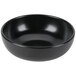 A black Hall China bistro bowl on a white surface.