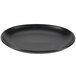 A black oval china platter with a rim.