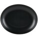 A black oval china platter with a white background.