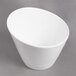 A white porcelain tall slant bowl with a small rim.