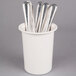 A white Cal-Mil flatware cylinder with silverware in it.