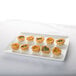 A Libbey ultra bright white rectangular porcelain tray with small pastries on it.