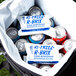 A bag full of beverage and Polar Tech Re-Freez-R-Brix foam freeze packs with a close-up of a soda can.