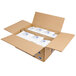 A cardboard box with white packages of Polar Tech 12 oz. Ice Brix cold packs inside.