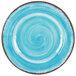 A blue plate with a brown rim and a white swirl pattern.