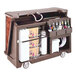 A brown Cambro portable bar cart with bottles and containers on it.