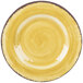 A yellow plate with a brown rim and a spiral pattern.