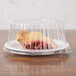 A piece of pie in a Dart clear plastic container with a clear lid.