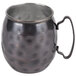 A black metal World Tableware hammered antique copper Moscow Mule mug with a handle.
