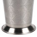 A close-up of a Libbey stainless steel mint julep cup with an etched pattern.