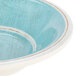 A Carlisle Aqua Melamine fruit bowl with a blue and white surface.