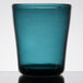 A teal Carlisle Tritan plastic double rocks glass with a white background.