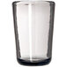 A clear Carlisle Tritan plastic juice glass with a smoke bottom and black rim.
