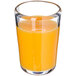 A Carlisle Mingle Tritan plastic juice glass filled with orange juice.