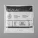 A white package with black and white text that reads "Dezcal Coffee Equipment Scale Removing Powder"