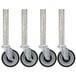 A row of Advance Tabco stainless steel casters with black wheels.