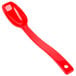 A red plastic Cambro salad bar spoon with a handle.