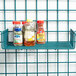 A Metro SmartWall shelf with clear containers of herbs and spices on it.