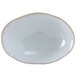 A white oval Tuxton China bowl with a white border.
