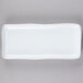 A white rectangular china tray with a thin rim.