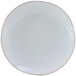 A white Tuxton Artisan china plate with a rim.