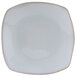 A white Tuxton Artisan china pasta plate with a small circle in the center.