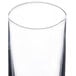 A clear Spiegelau highball glass with a curved edge.