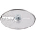 A Robot Coupe 5/16" Julienne Cutting Disc, a circular metal disc with a small hole in the center.