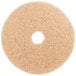 A white circular 3M Natural Blend burnishing floor pad with a hole in the middle.