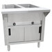 A stainless steel Advance Tabco commercial hot food table with two sliding doors.
