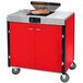 A red Lakeside mobile cooking cart with an induction burner and a pan on top.