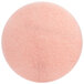 A pink circular 3M floor pad with a circle in the middle.
