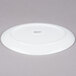 A white Arcoroc porcelain platter with an oval design.