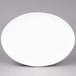 An oval white Arcoroc porcelain platter.