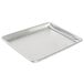 A Chicago Metallic aluminum sheet pan with curled rim on a counter.