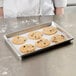 A Chicago Metallic aluminum sheet pan with cookies on it.