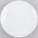 A white Chef & Sommelier bone china plate with a white rim on a gray surface.