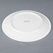 A Chef & Sommelier white bone china plate with a white rim.