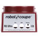 A red container with a white label reading "Robot Coupe 39109 Motor Support Assembly"