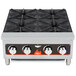 A Vollrath countertop gas range with four burners.