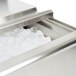An Eagle Group stainless steel insulated underbar ice chest filled with ice on a counter.