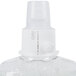 A close up of a plastic bottle of GOJO Clear & Mild hand soap with a white cap.