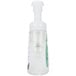 A clear plastic bottle of GOJO Green Certified fragrance free foaming hand soap with a white pump.