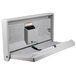 A grey plastic Gamco baby changing table with a key holder.