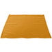 A gold Intedge cloth napkin on a white background.